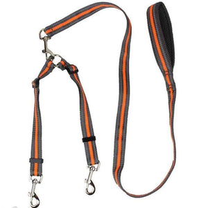 Walkin’ Wheelchair Dog Leash in fluorescent orange with reflective stitching attached to dog wheelchair