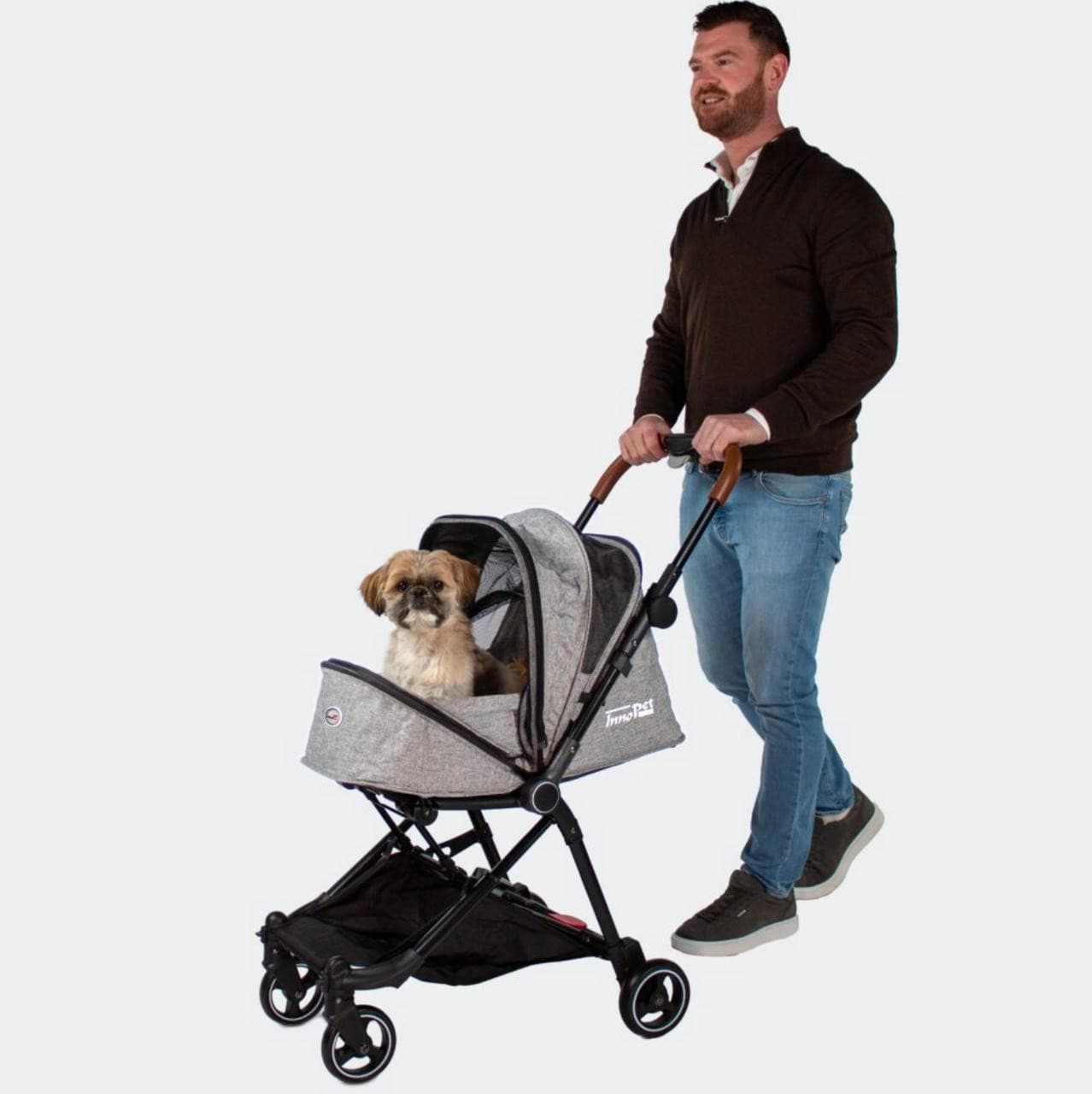 Innopet City Buggy pet stroller with mesh canopy, swivel wheels, rear brakes, and storage basket for small breeds