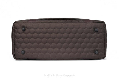Black Muffin & Berry travel carrier for pets with breathable mesh panels and secure zip closure
