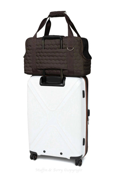 Black Muffin & Berry travel carrier for pets with breathable mesh panels and secure zip closure