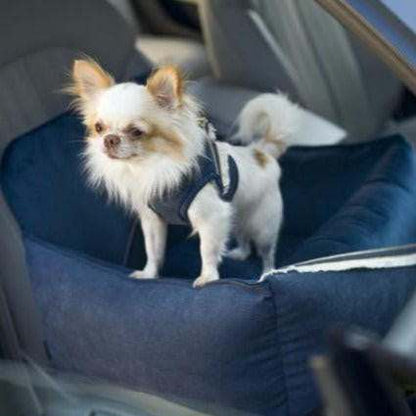 Luxury navy blue dog car seat by Oh Charlie with golden accents and secure leashes for safe travel