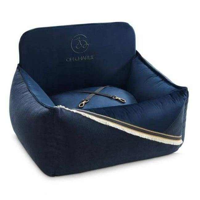 Luxurious navy blue dog car seat with golden accents by Oh Charlie, providing comfort and safety for dogs during travel