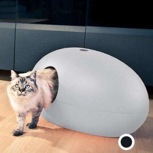 The Cat Poo Pod white designer cat litter box with paw-shaped handle and ergonomic scoop