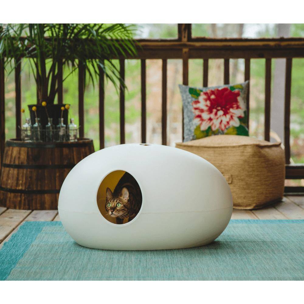 The Cat Poo Pod white designer cat litter box with paw-shaped handle and ergonomic scoop