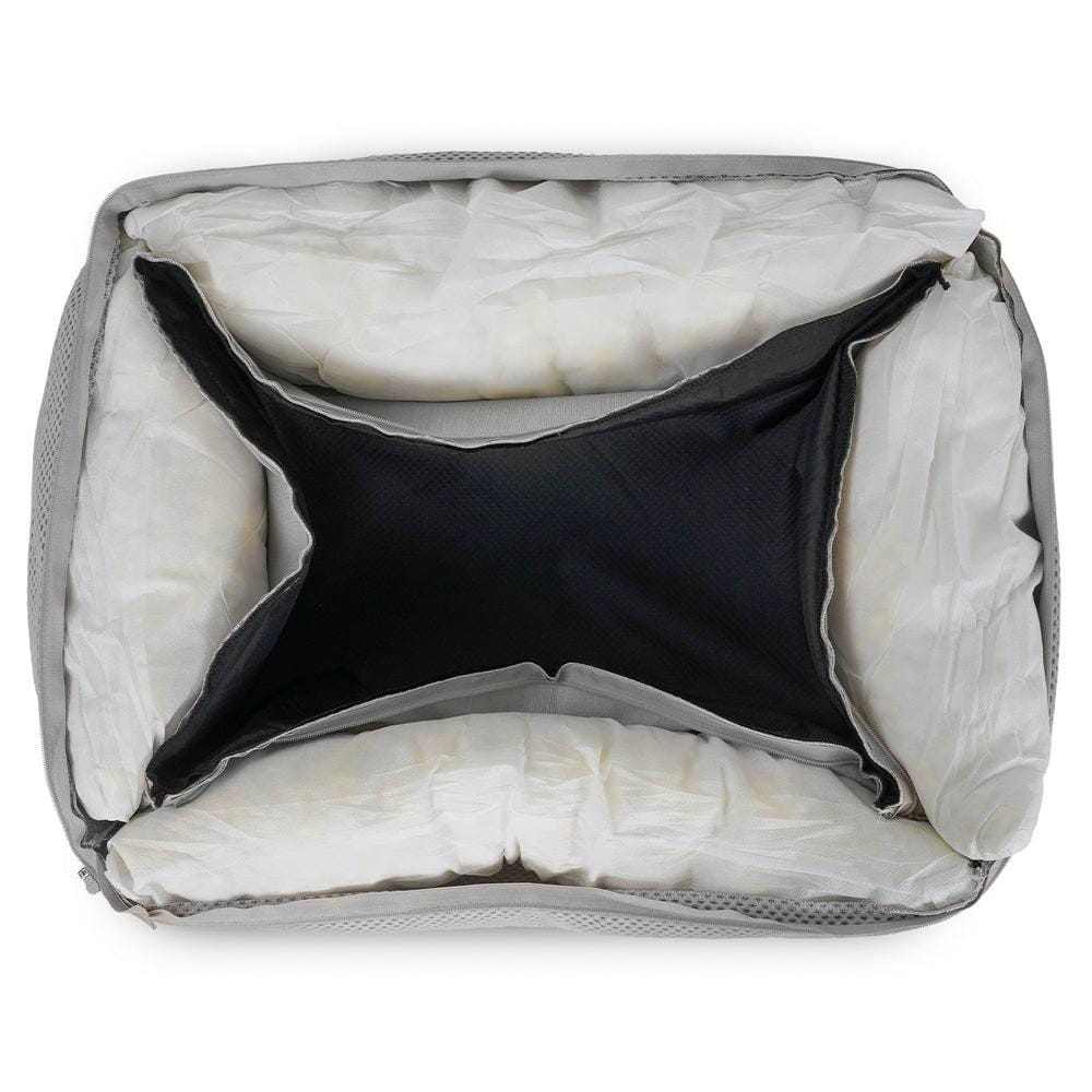 Orthopedic memory foam dog bed with beige knitted upholstery and supportive bolster walls