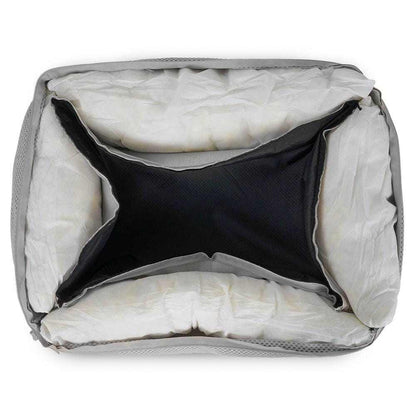 Orthopedic memory foam dog bed with beige knitted upholstery and supportive bolster walls
