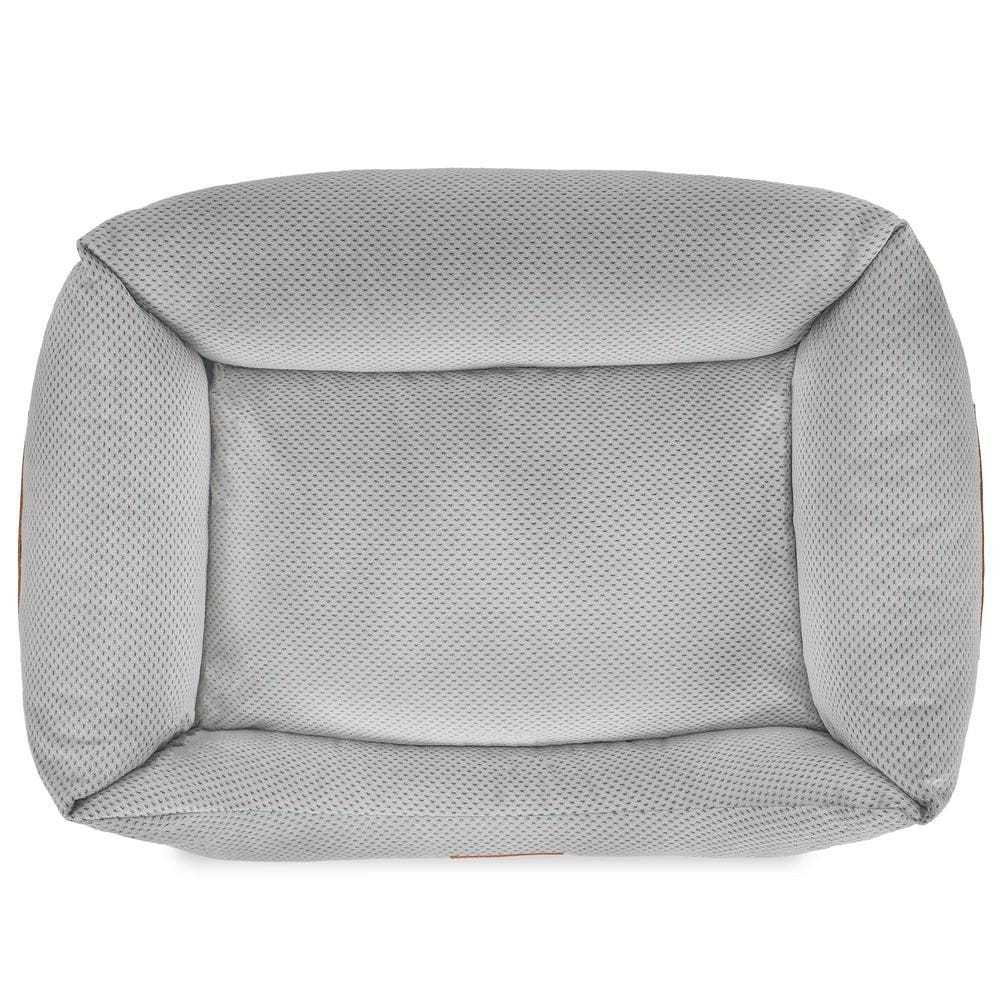 Orthopedic memory foam dog bed with beige knitted upholstery and orthopedic support