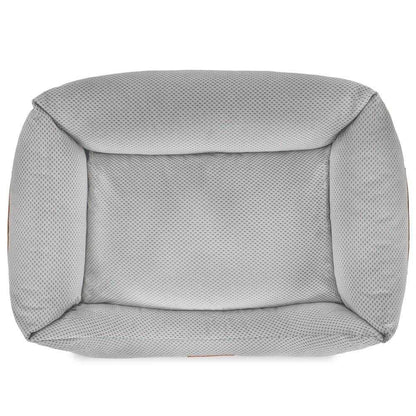 Orthopedic memory foam dog bed with beige knitted upholstery and orthopedic support