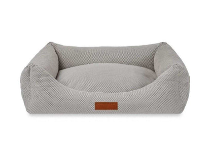 Orthopedic memory foam dog bed with grey knitted upholstery for joint support and comfort