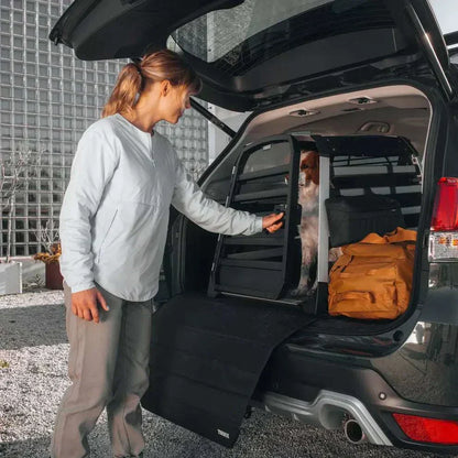 Thule Allax crash-tested black dog car crate installed in vehicle boot with secure straps