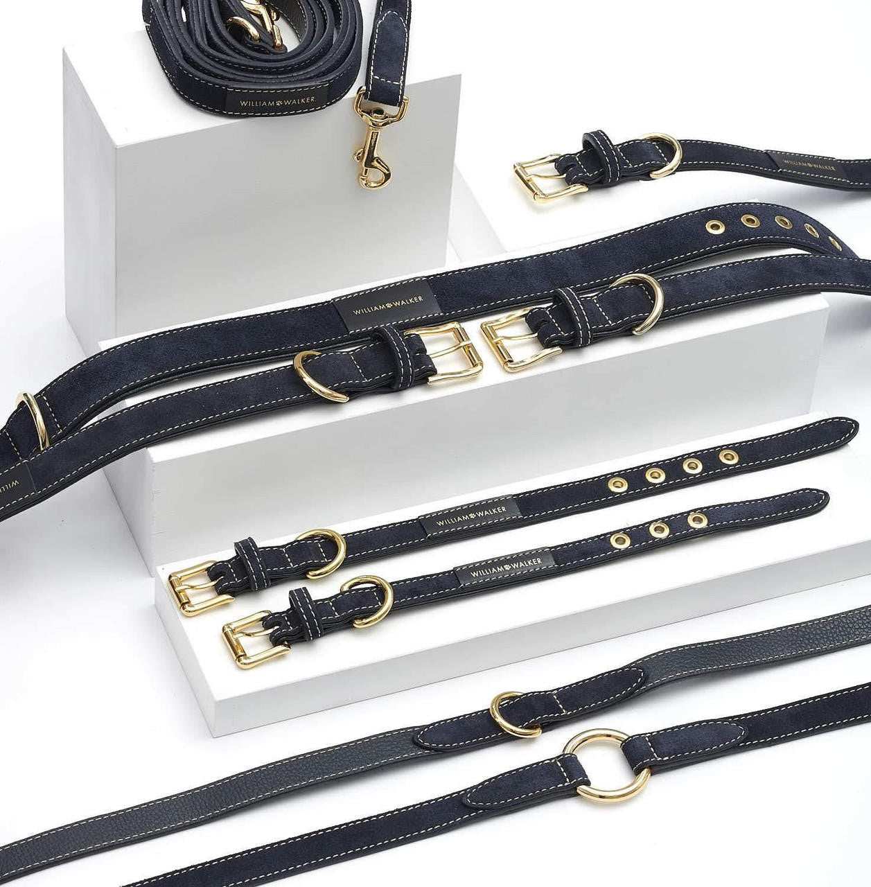 Dark blue suede leather dog collar with white stitching and brass hardware by William Walker